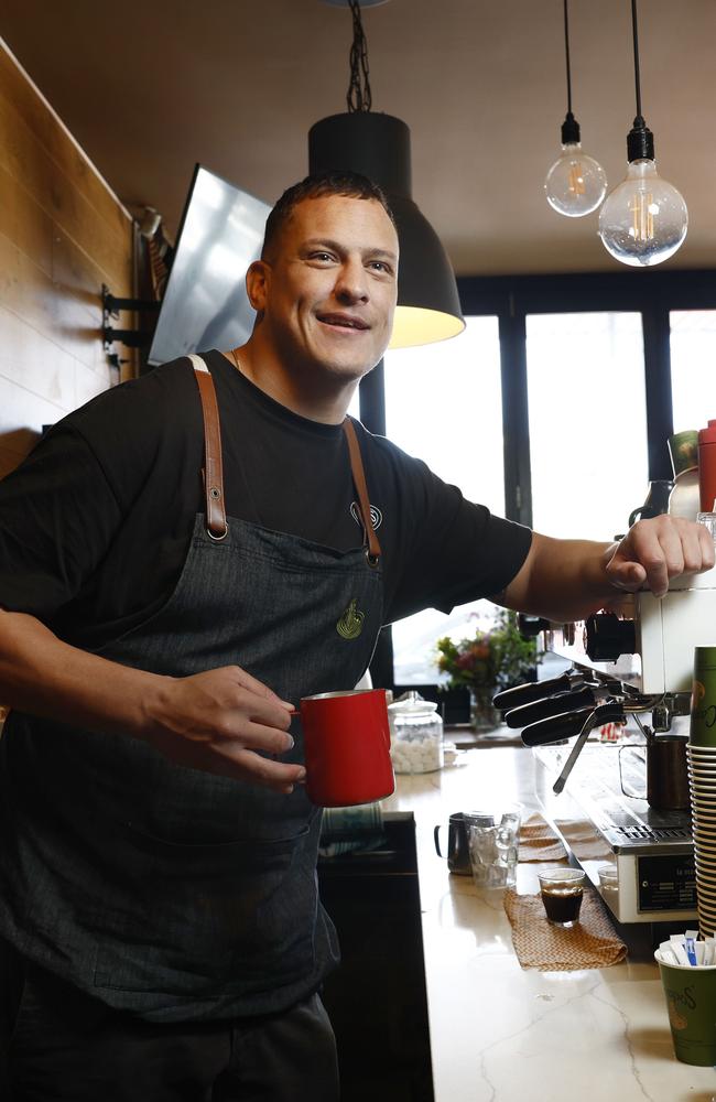 Pictured at his cafe at Kyeemagh in Sydney is former Roosters NRL player Kane Evans. Picture: Richard Dobson