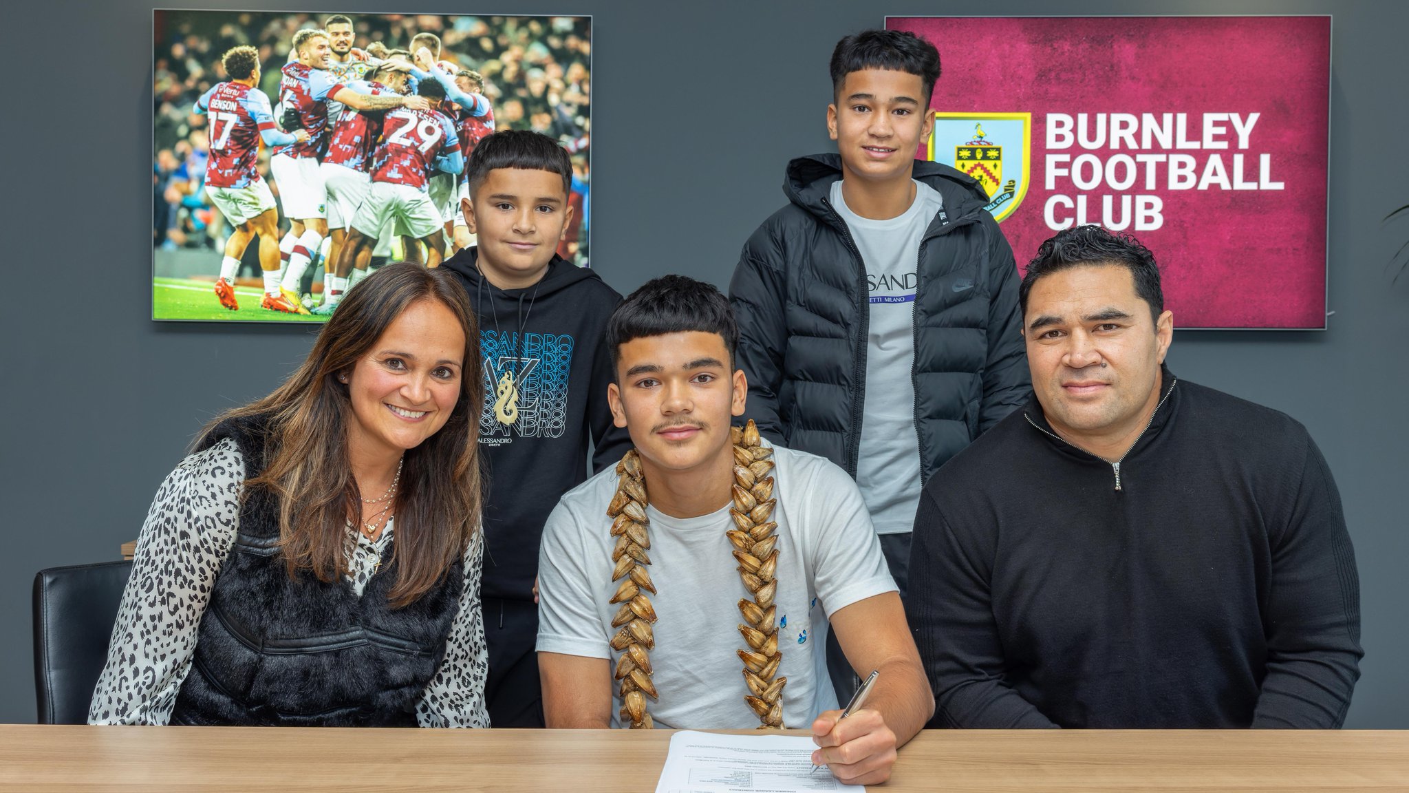 Marley Leuluai signs with Burnley FC with his family by his side.