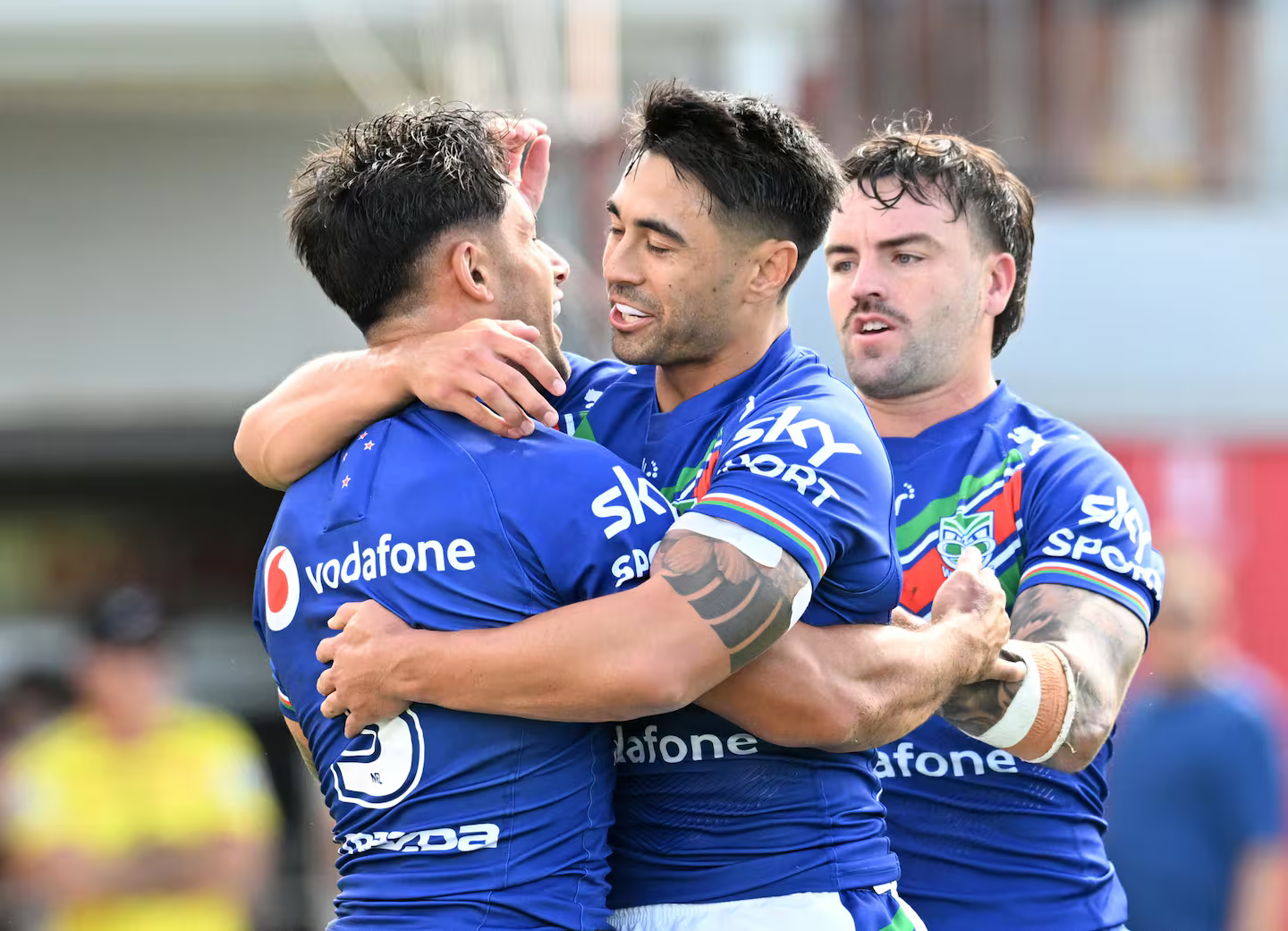 Jesse Arthars, Shaun Johnson and Wayde Egan celebrate a Warriors try. Photo / Photosport