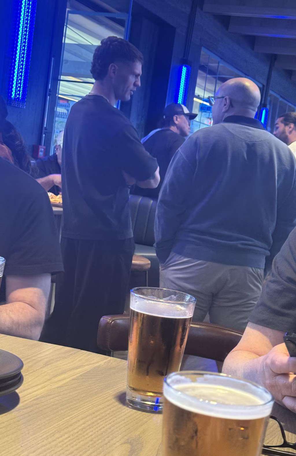 Kalyn Ponga spotted chatting with Warriors general manager of recruitment Andrew McFadden at a Warriors sports bar in Auckland. Picture: Supplied.