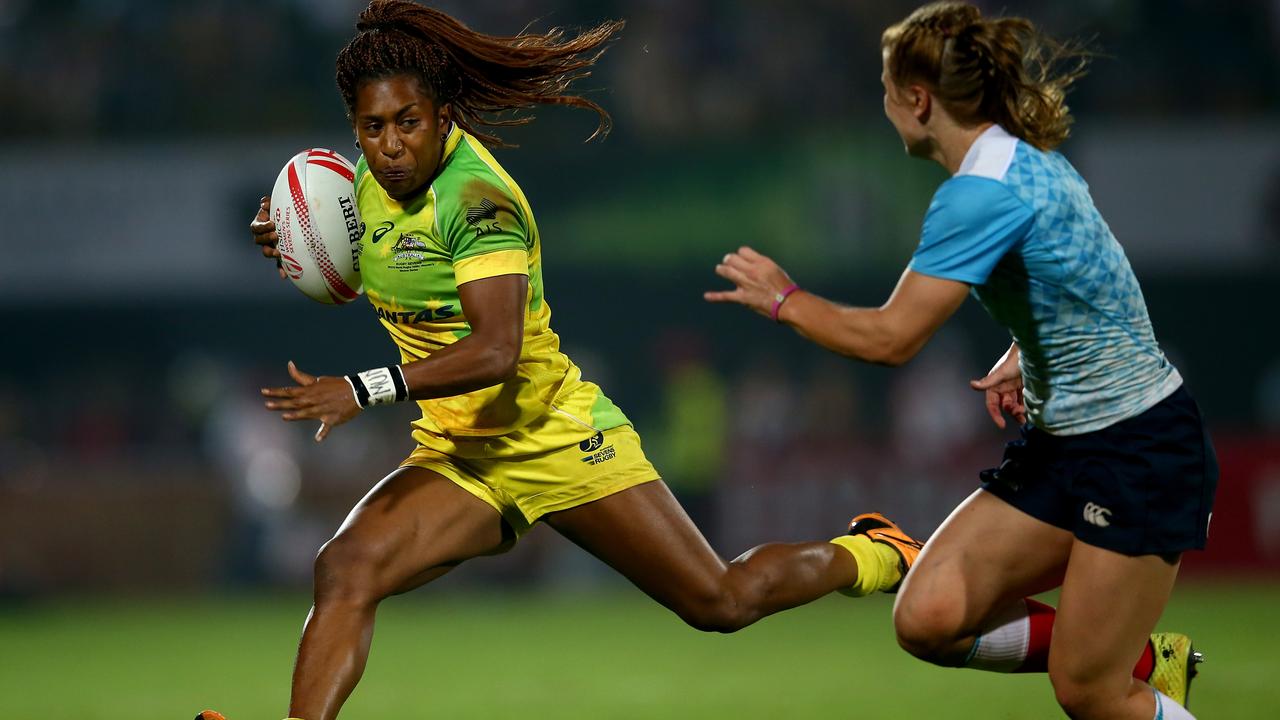 DUBAI, UNITED ARAB EMIRATES - DECEMBER 04: Ellia Green of Australia in action against Russia during the Emirates Dubai Rugby Sevens - HSBC World Rugby Women's Sevens Series Cup Final on December 4, 2015 in Dubai, United Arab Emirates. (Photo by Francois Nel/Getty Images)